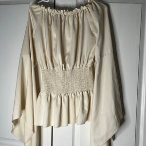 Creme off the shoulder flair sleeve top